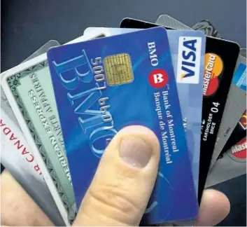  ?? THE CANADIAN PRESS FILES ?? Credit cards are displayed in Montreal in a 2012 photo. The next economic downturn will result in higher credit card losses at Canadian banks than the last recession due to the “unpreceden­ted” levels of consumer debt fuelled by the housing boom, says...