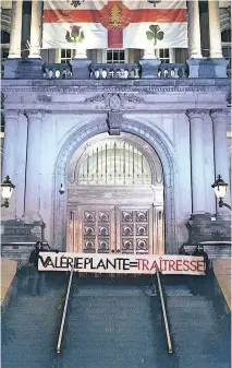  ??  ?? A banner that reads “Valérie Plante = Traîtresse” was placed at Montreal City Hall in January 2018. This photo and the three at the top of the page appear on the Facebook page of Atalante, a fascist organizati­on based primarily in Quebec City.