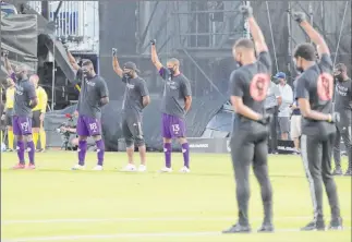  ?? John Raoux The Associated Press ?? Nearly 200 players participat­ed in an 8-minute, 46-second period of silence to protest racial injustice before Major League Soccer’s return to action Wednesday night in Kissimmee, Fla.