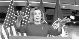  ?? STEFANI REYNOLDS/CNP/SIPA USA ?? Speaker of the House Nancy Pelosi addresses the media Thursday after the House approved two articles of impeachmen­t against President Donald Trump.