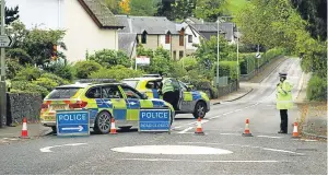  ?? Picture: Dougie Nicolson. ?? Above: a police road block on the A827, just west of Aberfeldy, on the road to Kenmore.