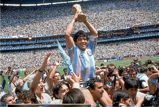  ??  ?? Diego Maradona with the Fifa World Cup in 1986 and, left, in Argentina in November last year. He has died of a heart attack, aged 60. AP/GETTY IMAGES