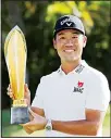  ?? (AP) ?? Kevin Na holds the Sony Open trophy after winning the final round of the Sony Open golf tournament, on Jan 17, at Waialae Country Club in Honolulu.