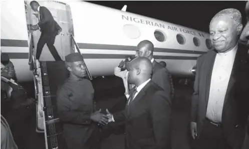  ?? PHOTO: State House ?? Vice President Prof. Yemi Osinbajo (left) about to board a plane at the Nnamdi Azikwe Airport in Abuja yesterday, to attend the African Union Summit that will formally open today in Kigali, Rwanda. With him is the Minister of Foreign Affairs, Geoffrey...