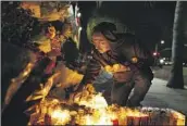  ?? Jason Armond Los Angeles Times ?? DANIEL CHAVARIN at a memorial Wednesday for his son Xavier, who was killed last week in El Sereno.