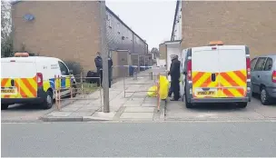  ?? Police at the scene in Ivydale, Skelmersda­le, after the discovery of a man’s body in a house ??