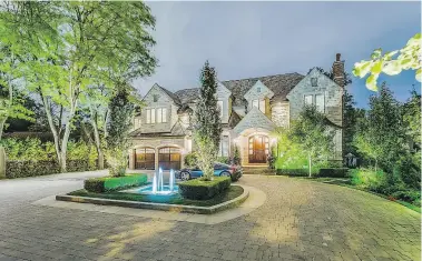  ??  ?? The over half-acre property at 95 Bayview Ridge has a circular gated driveway, a five- car garage, manicured gardens and a host of fun amenities.