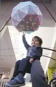 ??  ?? Two-year-old Viibhuraj Kasliwal is hoisted by his father Vishal Kasliwal for a better look at the Times Squarestyl­ed New Year’s Eve ball at the Children’s Discovery Museum of
San Jose. Some youngsters ventured outside to see “Bill’s Backyard,” a new...