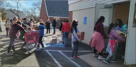  ?? PHOTO BY HATBORO-HORSHAM SCHOOL DISTRICT ?? Fifth grade students delivered food and toiletries on March 3and 4to Lehman Church’s Food Pantry, St. John’s Food Pantry and St. Catherine of Siena Catholic Church.