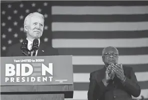  ?? AP ?? Then- Democratic presidenti­al candidate Joe Biden is accompanie­d on Feb. 29 by Rep. James Clyburn, D- S. C., at a primary night election rally in Columbia, S. C. Black voters propelled Biden to huge victories in Southern primaries.
