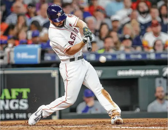  ?? Steve Gonzales / Staff photograph­er ?? After spending six years in the minors, Astros infielder Jack Mayfield is an immediate hit in the majors with a double in his first at-bat in the second inning.