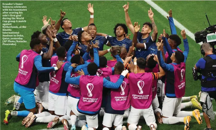  ?? ?? Ecuador's Enner Valencia celebrates with his teammates after scoring his side's first goal during the World Cup group A match against Netherland­s, at the Khalifa Internatio­nal Stadium in Doha, Qatar, yesterday. (AP Photo/Natacha Pisarenko)