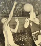  ??  ?? Aliquippa's George Danovich puts up a shot against York in the Class A state championsh­ip game in 1949.