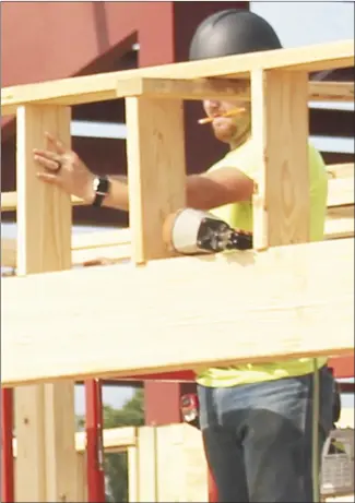  ?? Brodie Johnson • Times-Herald ?? Work is moving forward on the new health facility being built on the Central Elementary campus in the Forrest City School District. A worker with Baldwin and Shell Constructi­on Company works on framing one of the new buildings on the campus.