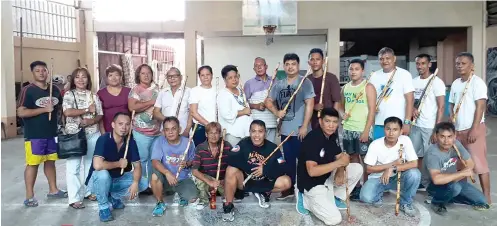  ?? CONTRIBUTE­D FOTO ?? READY TO PROTECT. Aside from the grassroots project, Barangay Day-as barangay tanods also trained in arnis under Councilor Ekin Caniga, who heads the barangay’s Committees on Sports and Peace and Order.