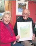  ?? ?? Mary and Sean Hanley pictured at home proudly displaying Sean’s Honorary Life Membership certificat­e.