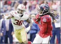  ??  ?? In this Dec 10, 2017 file photo, Houston Texans wide receiver DeAndre Hopkins (10) makes a catch in front of San Francisco 49ers cornerback Dontae Johnson (36) during the first half of an NFL football game, in
Houston. (AP)