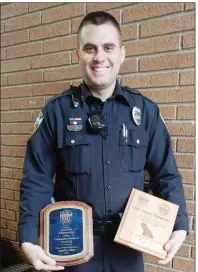  ?? SUBMITTED ?? Jason Denison holds the awards he received after he was named Patrol Officer of the Year by the Searcy Police Department and was given an award from the Central Arkansas Drug Task Force. Denison received the honors during the Searcy Police Department...