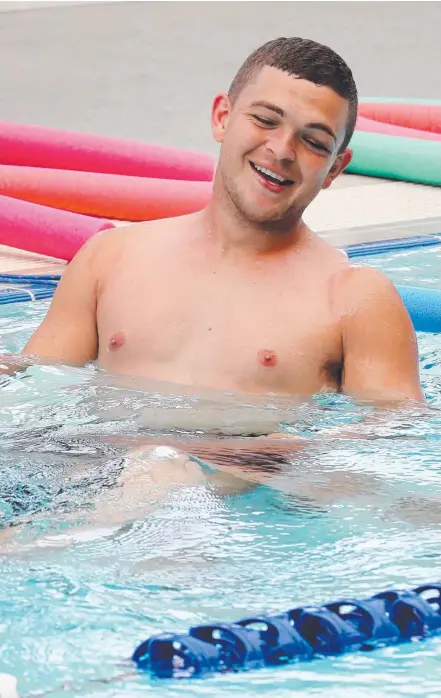  ??  ?? Ash Taylor relaxes in the pool at the Titans’ recovery session at Parkwood yesterday. Picture: RICHARD GOSLING EMMA GREENWOOD