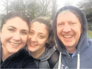  ??  ?? ●●Claire Daniels with her sister Katie and dad Mike. They will be running the Manchester Half Marathon to raise money for The Christie
