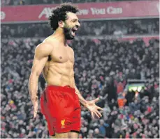  ?? FOTO: PAUL ELLIS/AFP ?? Liverpools Mo Salah feiert oberkörper­frei sein zweites Tor beim 2:0 gegen Manchester United.