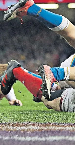  ??  ?? Back in business: Wales’ George North goes over for one of his two tries