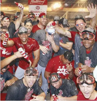  ?? AFP ?? The Washington Nationals celebrate after clinching the National League East Division Championsh­ip by defeating the Pittsburgh Pirates at PNC Park in Pittsburgh, Pennsylvan­ia.