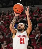  ?? Kevin M. Cox/Associated Press ?? Guard Emanuel Sharp scored a career-high 20 points as UH routed Louisiana-Monroe in Monday’s opener.