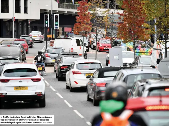  ?? Ben Birchall ?? > Traffic in Anchor Road in Bristol City centre, as the introducti­on of Bristol’s clean air zone has been delayed again until next summer