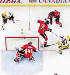  ?? —AFP ?? OTTAWA: Craig Anderson #41 of the Ottawa Senators makes a save against Sidney Crosby #87 of the Pittsburgh Penguins as Kyle Turris #7 and Erik Karlsson #65 of the Senators and Chris Kunitz #14 of the Penguins react in the second period in Game Six of...