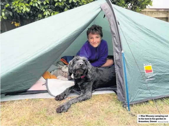  ?? Woosey Family ?? Max Woosey camping out in his tent in his garden in Braunton, Devon