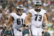  ?? THE ASSOCIATED PRESS FILE ?? Isaac Seumalo, right, went out injured in training camp in 2016 and promptly lost his starting spot then to Stefen Wisniewski, left. Now the status update is on the other Eagles’ foot.