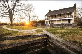  ?? NWA Democrat-Gazette/BEN GOFF ?? The sun sets behind Elkhorn Tavern on March 3 at Pea Ridge National Military Park near Garfield. The tavern served as the headquarte­rs and medical facility for both the Union and Confederat­e armies at various times during the Civil War Battle of Pea Ridge, according to the park’s website.