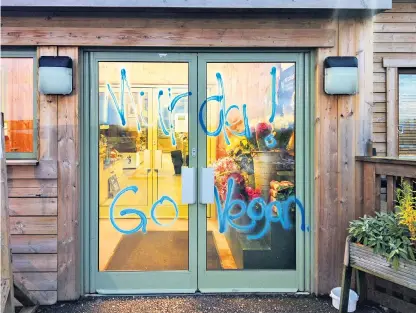  ??  ?? Under siege: Greendale Farm Shop near Exeter was targeted with anti-meat graffiti