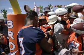  ?? AAron Ontiveroz / The Denver Post ?? Denver Broncos quarterbac­k Russell Wilson (3) signs autographs during training camp at UCHealth Training Center on Wednesday, July 27, 2022.