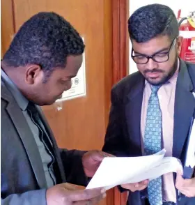  ?? Photo: Salote Qalubau ?? Lawyer Kaminieli Tudravu (left) with Victor Sharma at the High Court in Lautoka on May 18, 2022.