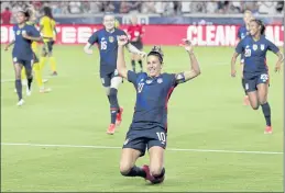  ?? MICHAEL WYKE — THE ASSOCIATED PRESS ?? U.S. forward Carli Lloyd slides on the turf after scoring in the first minute against Jamaica during the first half of their 2021 WNT Summer Series match on Sunday in Houston.