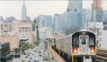  ?? FRANK FRANKLIN II/THE ASSOCIATED PRESS/FILES ?? The No. 7 subway train travels through Queens. Riding New York’s subway system offers visitors a colourful and affordable adventure.