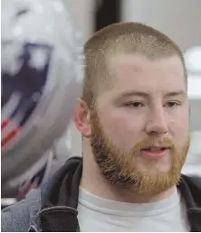  ?? STAFF PHOTO BY JOHN WILCOX ?? HOLDING COURT: Patriots rookie guard Joe Thuney talks with the media at his locker after practice yesterday.