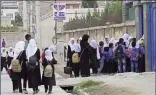  ??  ?? Students arrive to attend their morning classes at a government middle school in Kabul