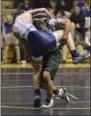  ?? STAN HUDY - THE SARATOGIAN ?? Shenendeho­wa’s Pable Delarosa has Columbia’s Anthony Poggoli up and off the mat during the opening 113-pound final Tuesday night during the Section 2 Dual Championsh­ip final in Clifton Park.