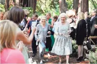  ?? FILE/TOM O'NEAL/TGO WEDDINGS/LUCY SCHANZER VIA AP ?? Flossie “Grammy” Pack, left, and Nancy “Grongong” Rutchik, right, are flower girls in a wedding.