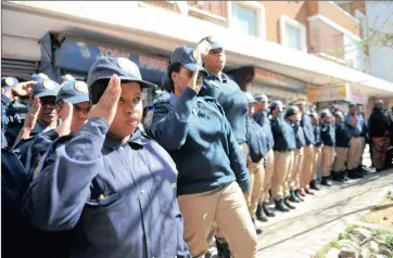  ?? PICTURE: ITUMELENG ENGLISH ?? SHOW OF SOLIDARITY: Members of the metro police pay their respects to their colleague, Simon Mabatamela, who was shot and killed by robbers in Rosettenvi­lle last month.