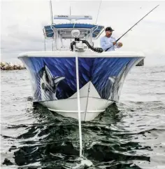  ??  ?? HOLD ME The Minn Kota Spot-Lock feature uses GPS guidance and directiona­l motor thrust to hold a boat on station. Longer shafts enable effective use on the towering bows of offshore fishing boats.