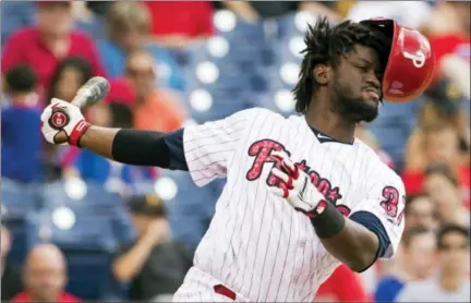  ?? CHRIS SZAGOLA — THE ASSOCIATED PRESS ?? Philadelph­ia Phillies’ Odubel Herrera loses his helmet on a swing and miss during the fourth inning of a baseball game against the Pittsburgh Pirates Tuesday in Philadelph­ia.