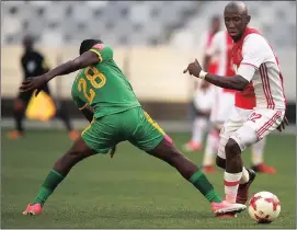  ?? Picture PHANDO JIKELO ?? LATE LOSERS: Ajax’s Mark Myambela is challenged by Victore Ltsoalo of Baroka FC. Ajax lost, and missed out on a top eight finish.