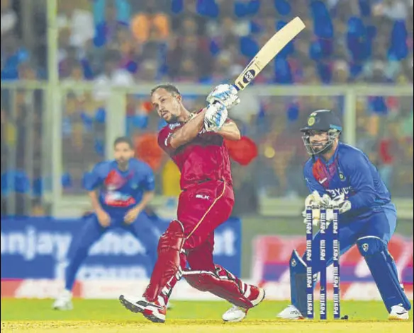  ?? PTI ?? West Indies’ Lendl Simmons hit four fours and four sixes in his 45-ball unbeaten 67 during the second T20I at Greenfield Stadium in Thiruvanan­thapuram on Sunday.