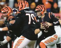  ?? ROB CARR/GETTY ?? Bengals quarterbac­k Joe Burrow runs with the ball against the Ravens during their wild-card game on Jan. 15 at Paycor Stadium in Cincinnati.