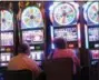  ?? WAYNE PARRY - THE AP ?? This June 24, 2016 photo shows gamblers playing slot machines at the Golden Nugget casino in Atlantic City, N.J.