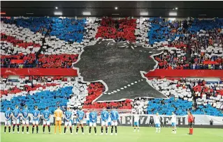  ?? ?? Flag tribute: Rangers fans at their Champions League match against Napoli